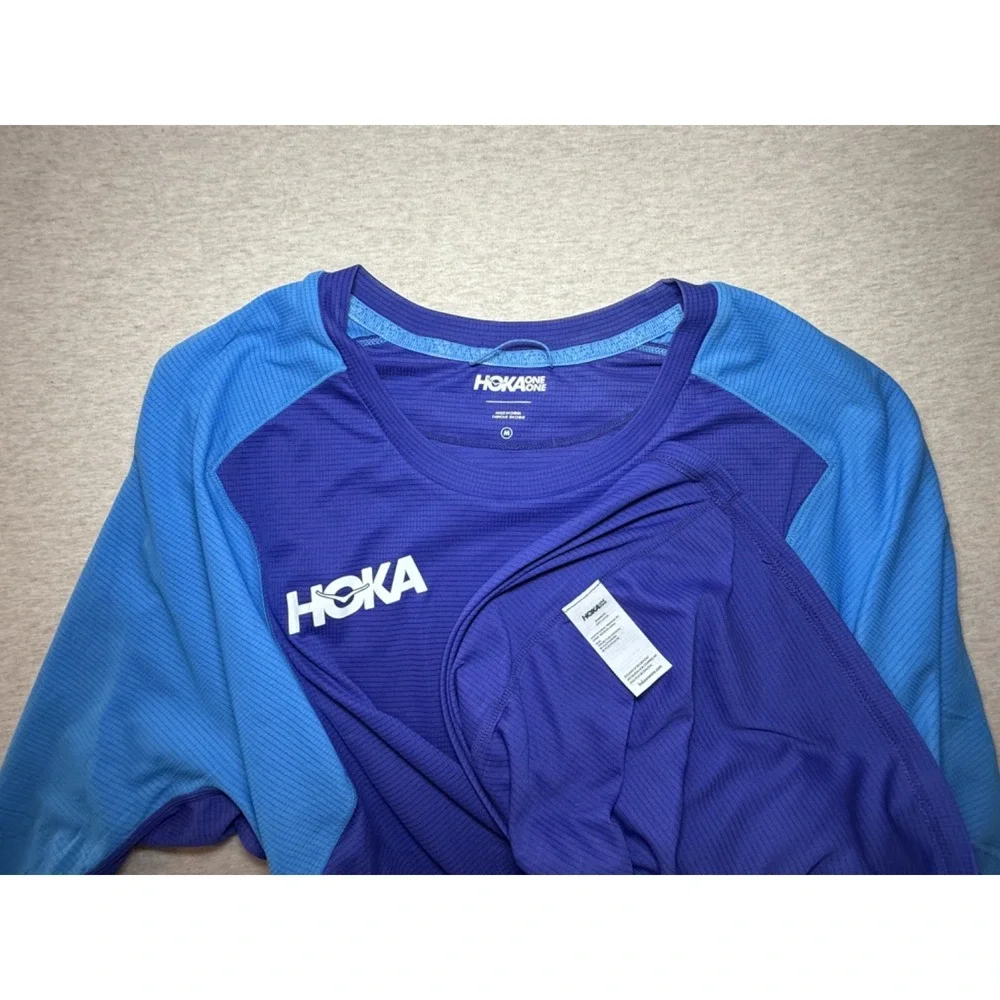 Hoka. Blue fitness shirt. size Medium. Blue 100% polyester 3/4 sleeve shirt